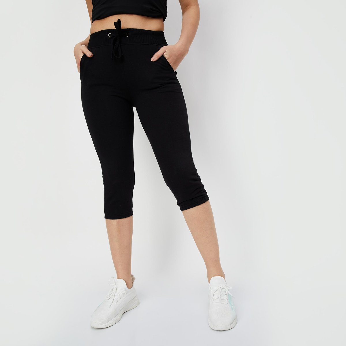 Buy Women Solid Drawstring Capris Online at just Rs. 499.0