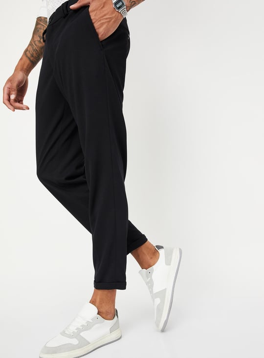 Men Solid Knit Carrot Fit Trousers