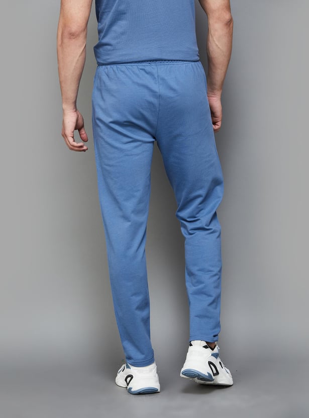 Buy KAPPA Men Solid Slim Fit Sports Track Pants from Kappa at just INR 