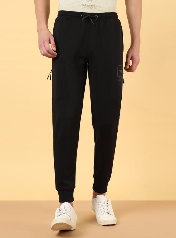 Buy WRANGLER Men Solid Joggers from Wrangler at just INR 3399.0