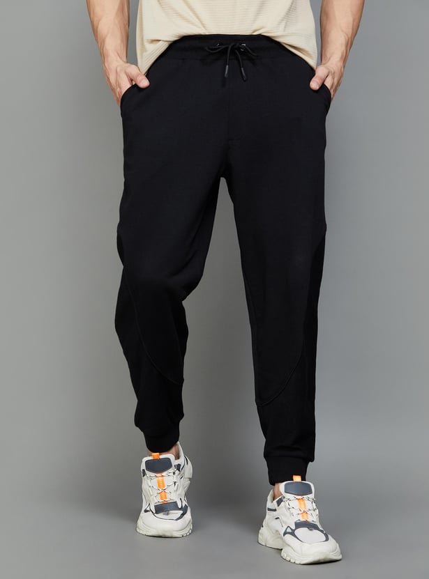 Buy FAME FOREVER ACTIVE Men Solid Regular Fit Joggers from Fame