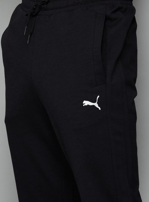 Buy PUMA Men Colourblocked Regular Fit Track Pants from PUMA at