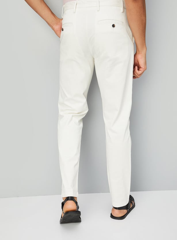 Buy Men Solid Straight Fit Chinos Online at just Rs. 1199.0