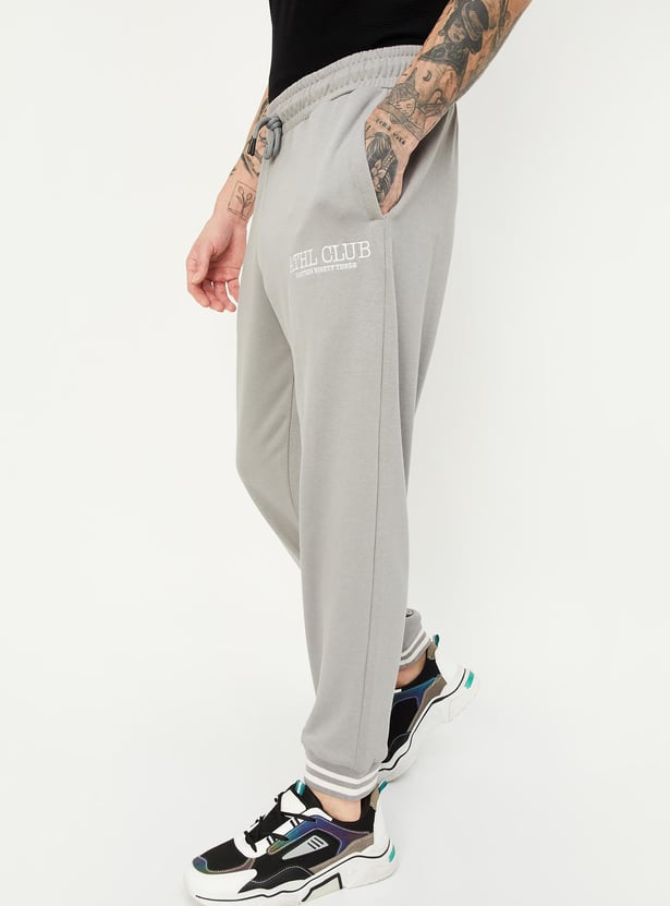 Buy Men Regular Fit Solid Athleisure Joggers Online at just Rs. 999.0