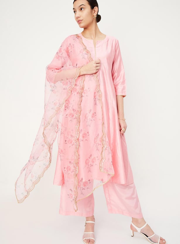 Rust Orange A-Line Kurta Set with Intricate Embroidered Yoke, Printed Dupatta and Matching Solid Pants.